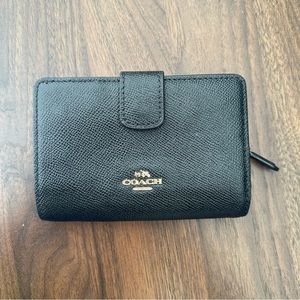 Black coach leather foldover wallet with snap closure